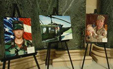 Portraits of fallen soldiers on display at the Wisconsin State Capitol in Madison, WI.